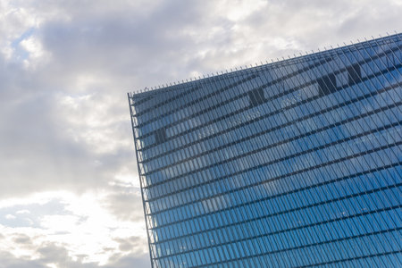 modern architectural background, glass and metal facade of contemporary buildingの写真素材