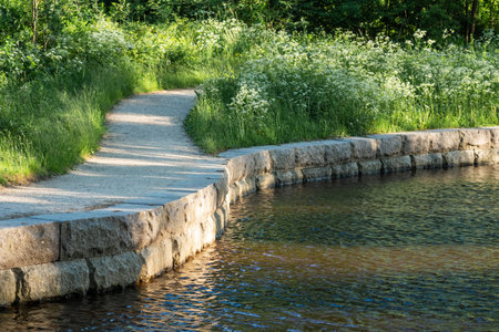 stone-lined stream bank in a park