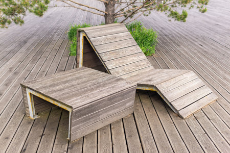 sun lounger and table in a public outdoor spaceの写真素材