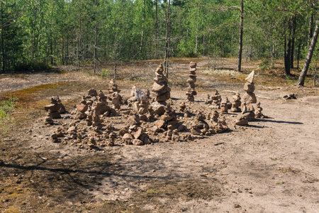 cairns, strange stone pyramids in the forestの写真素材