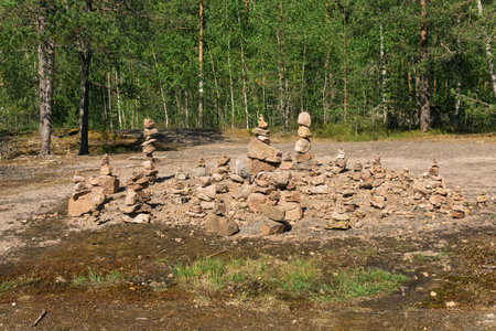 cairns, strange stone pyramids in the forestの写真素材