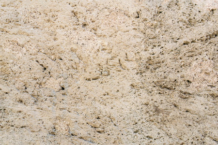 architectural background, texture, wall surface made of light stoneの写真素材