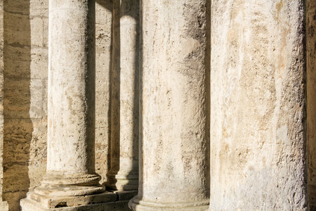 abstract architectural background - columns and walls made of light stoneの写真素材