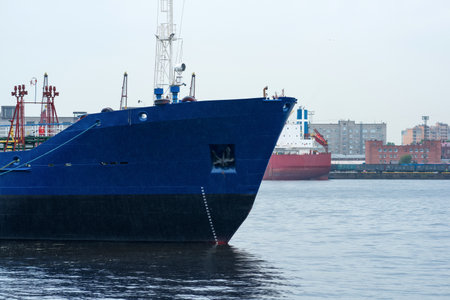 ships in a cargo port on a cloudy dayの写真素材