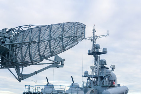 military background, naval radar antenna close up and warship in the backgroundの写真素材