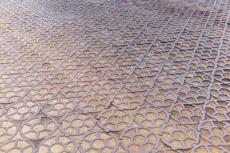 ancient 19th century pavement made of round cast iron blocks