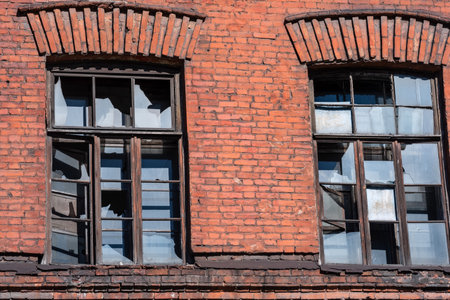 industrial background, windows of abandoned vintage factory buildingの写真素材