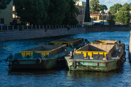 cargo barges on the river within the city limits