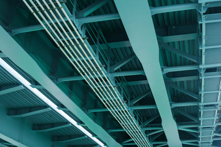 industrial background, view from below of the bridge supporting beams