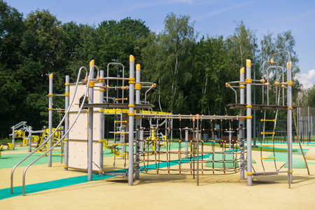 Playground for children and equipment for sports in the city park. Horizontal frame.