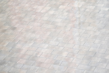 texture of the stone paving slabs in the form of square tiles
