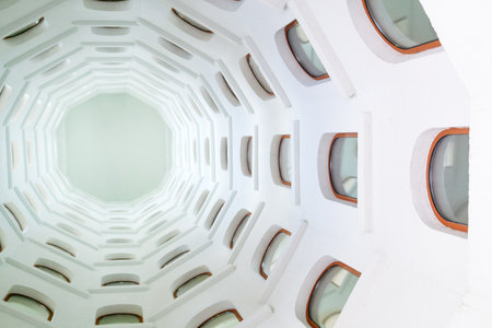 architectural background, spiral staircase with windows opening onto interior spaceの写真素材