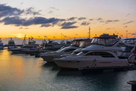 Sochi, Russia - January 21, 2026: luxury yachts and boats in the port at sunset
