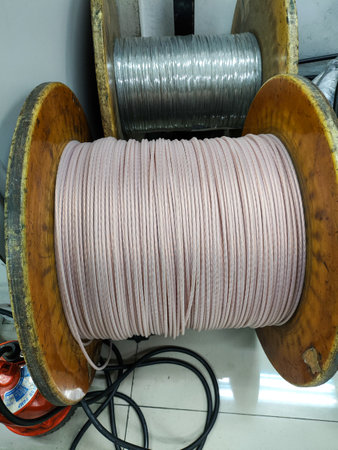 spool of small cable in the factory, closeup of photo.の写真素材
