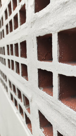 Brick wall covered with snow in winter, closeup of photoの写真素材