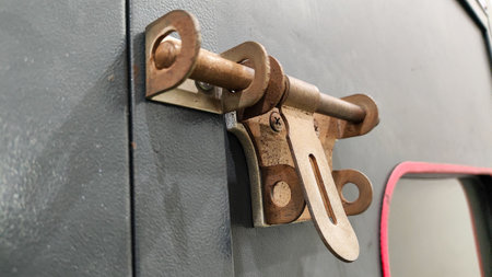Old door handle with keyhole and lock, close-up.の写真素材