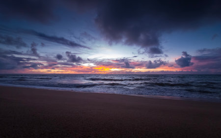 Beautiful sunset on the beach with dramatic sky and sea background.