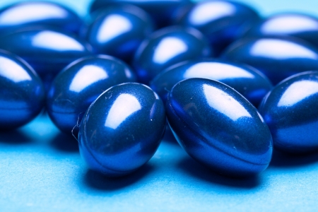 olorful vitamin gel capsules isolated on whiteback ground 