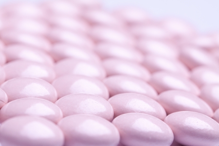 colorful vitamin gel capsules isolated on whiteback ground の写真素材