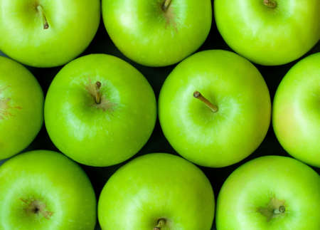 Green apples background closeupの写真素材