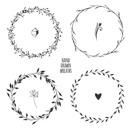 Set of four hand drawn floral wreaths for spring design isolated on white. Vector illustration.のイラスト素材