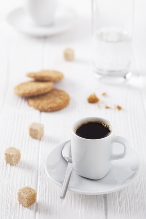 cup of coffee, brown sugar and cookiesの写真素材