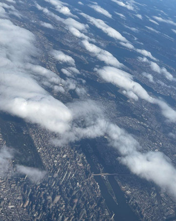 Exciting aerial view of the city from an airplane window during flight.の写真素材