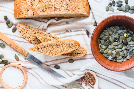 homemade mrye bread with flax and pumpkin seeds, yeast free, top view, crisp, clean eatingの写真素材