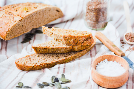 homemade rye bread unleavened with flax seed and pumpkin slices, healthy organic foodの写真素材