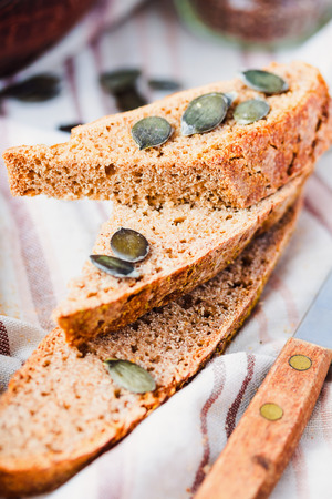 homemade rye bread unleavened with flax seed and pumpkin, slices, healthy organic foodの写真素材
