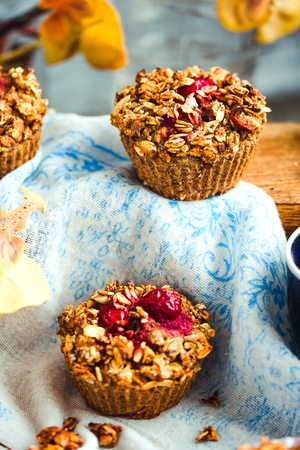 vegan oat muffins with cherries and granola, healthy dessert, pastryの写真素材