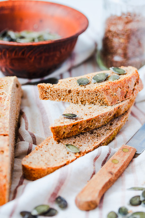 homemade rye bread unleavened with flax seed and pumpkin slices, healthy organic foodの写真素材