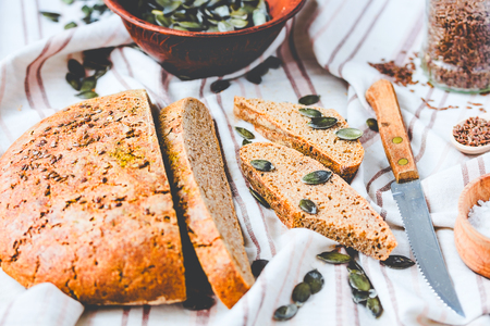 homemade rye bread unleavened with flax and pumpkin seeds, slices, yeast free, healthy organic foodの写真素材