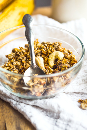 homemade banana granola with cashews and dried fruits, close-up, sweetの写真素材