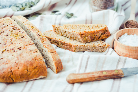 homemade rye bread unleavened with flax seed and pumpkin slices, healthy organic foodの写真素材