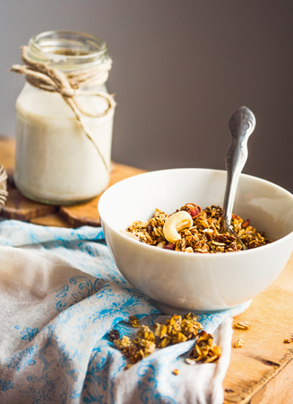 homemade granola with cashews and banana, vegan milk, healthy breakfastの写真素材