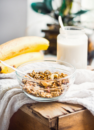 homemade granola with cashews and banana, vegan milk, healthy breakfastの写真素材