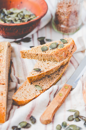 homemade rye bread unleavened with flax seed and pumpkin, slices, healthy organic food, selective focusの写真素材