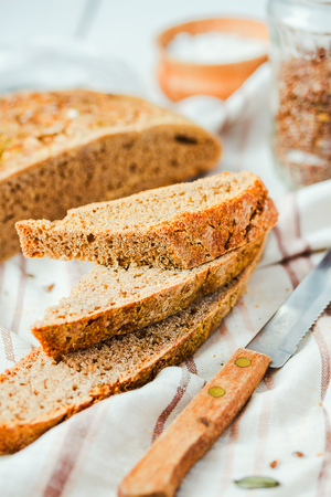homemade rye bread unleavened with flax seed and pumpkin, slices, healthy organic food, selective focus,closeupの写真素材