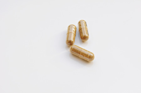 Herbal Drug ,alternative medicine in capsule on white backgroundの写真素材