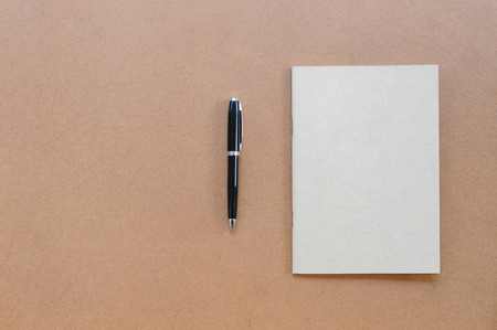 blank notebook and penの写真素材