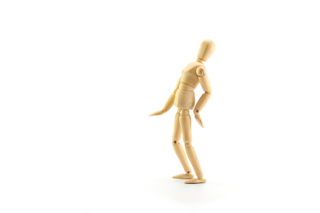 wooden dummy problem low back pain on white backgroundの写真素材