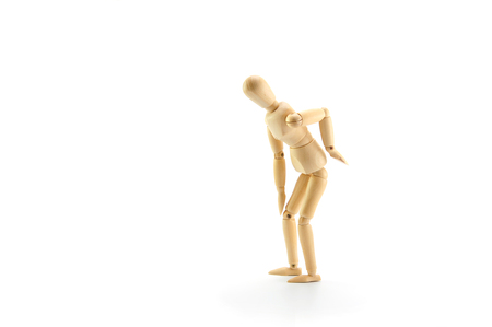 wooden dummy problem low back pain on white backgroundの写真素材