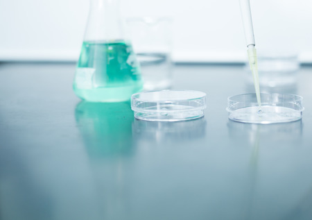 Pipette and Petri dish on Bench in a Fume Hoodの写真素材