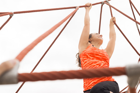 Happy Girl holding red Ropes while stretchingの写真素材