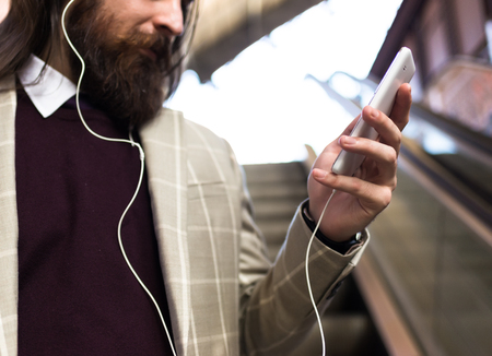 Close-up: Man enjoying music in a Stationの写真素材