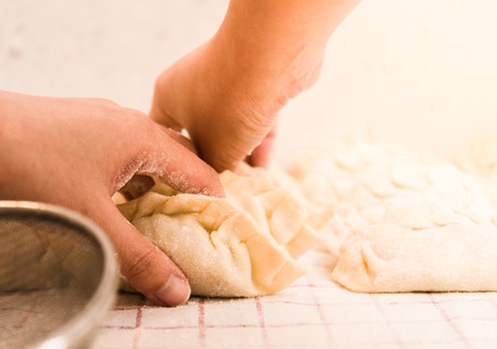 Rolling Homemade Dumplings.