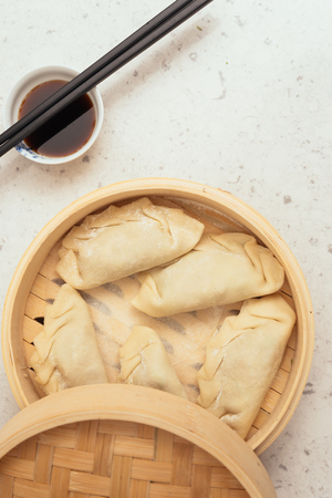 Handmade Dim Sum with Soja sauce in a Bamboo Containerの写真素材
