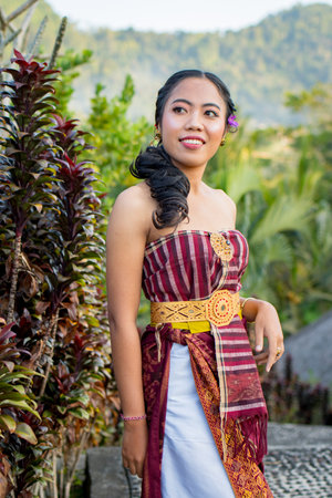 Thai woman wearing traditional costume in Bali island, Indonesia.の写真素材