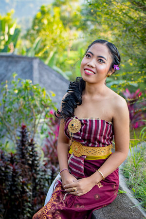 Beautiful Asian woman wearing traditional Thai dress in the garden, Indonesia.の写真素材